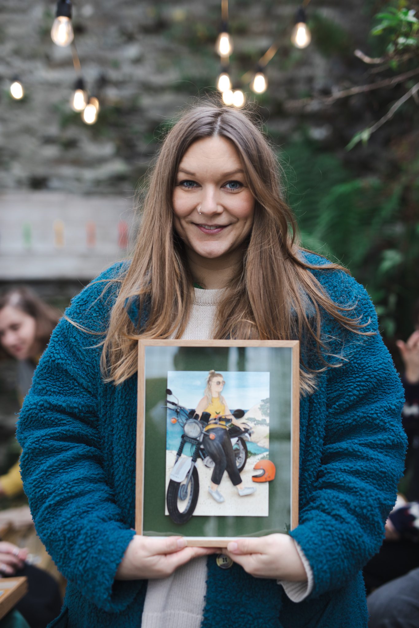 Jennie holding portrait by artist Bex Bourne