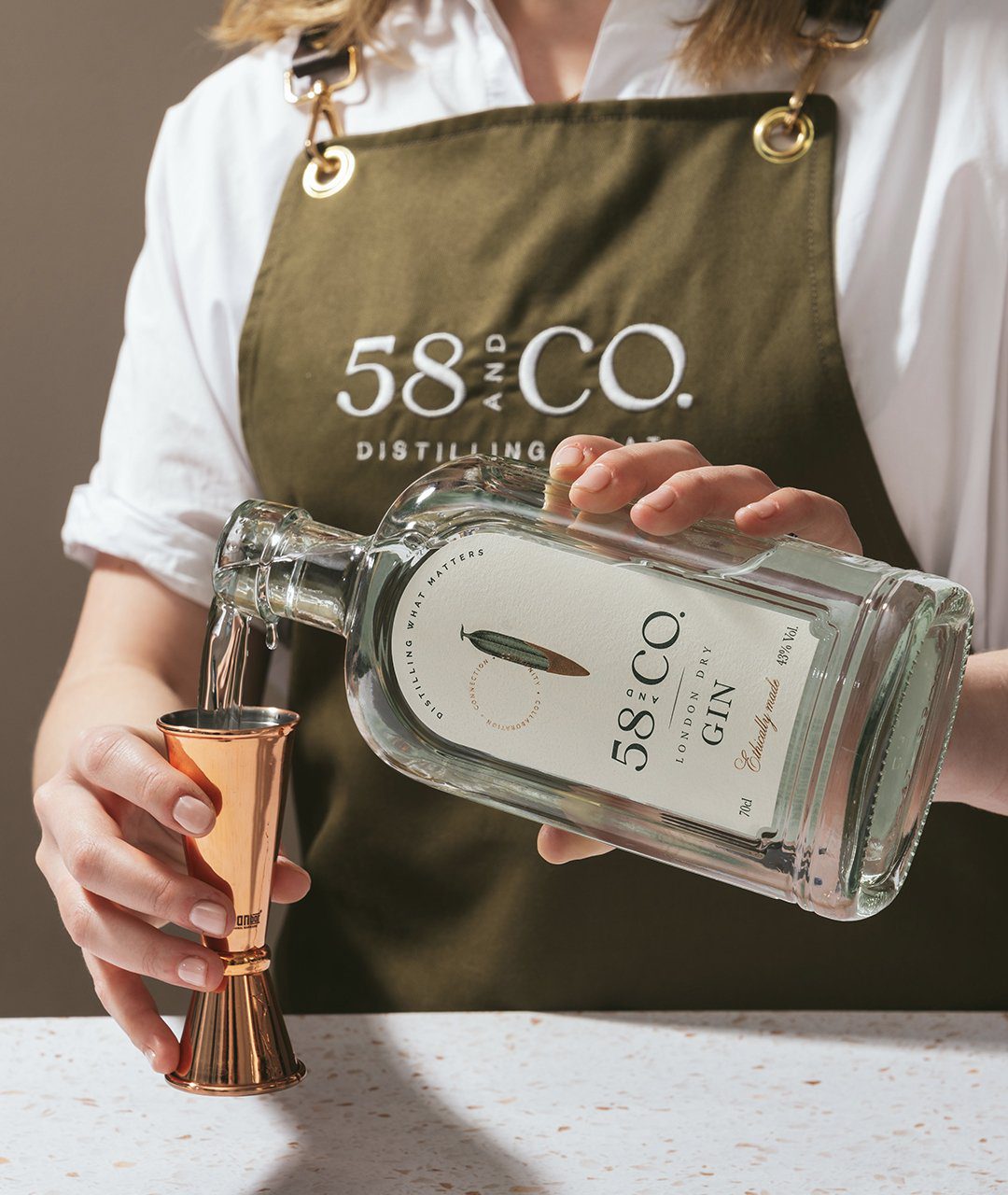 58 and Co Gin Being Poured Rebrand by Kingdom and Sparrow