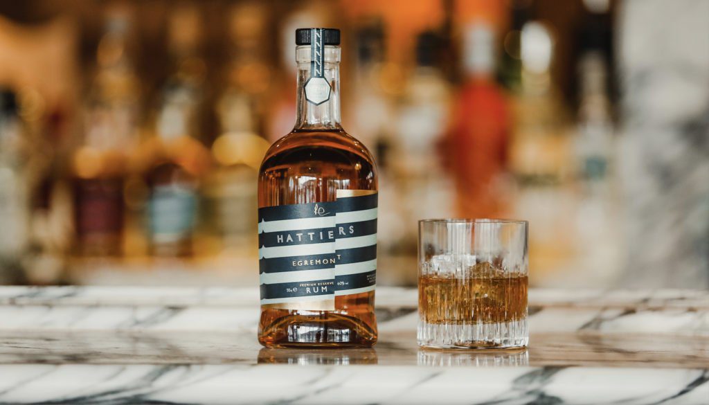 Hattier's Egremont rum bottle on a bar