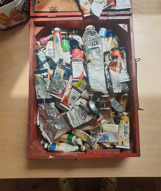 Box of used oil paints